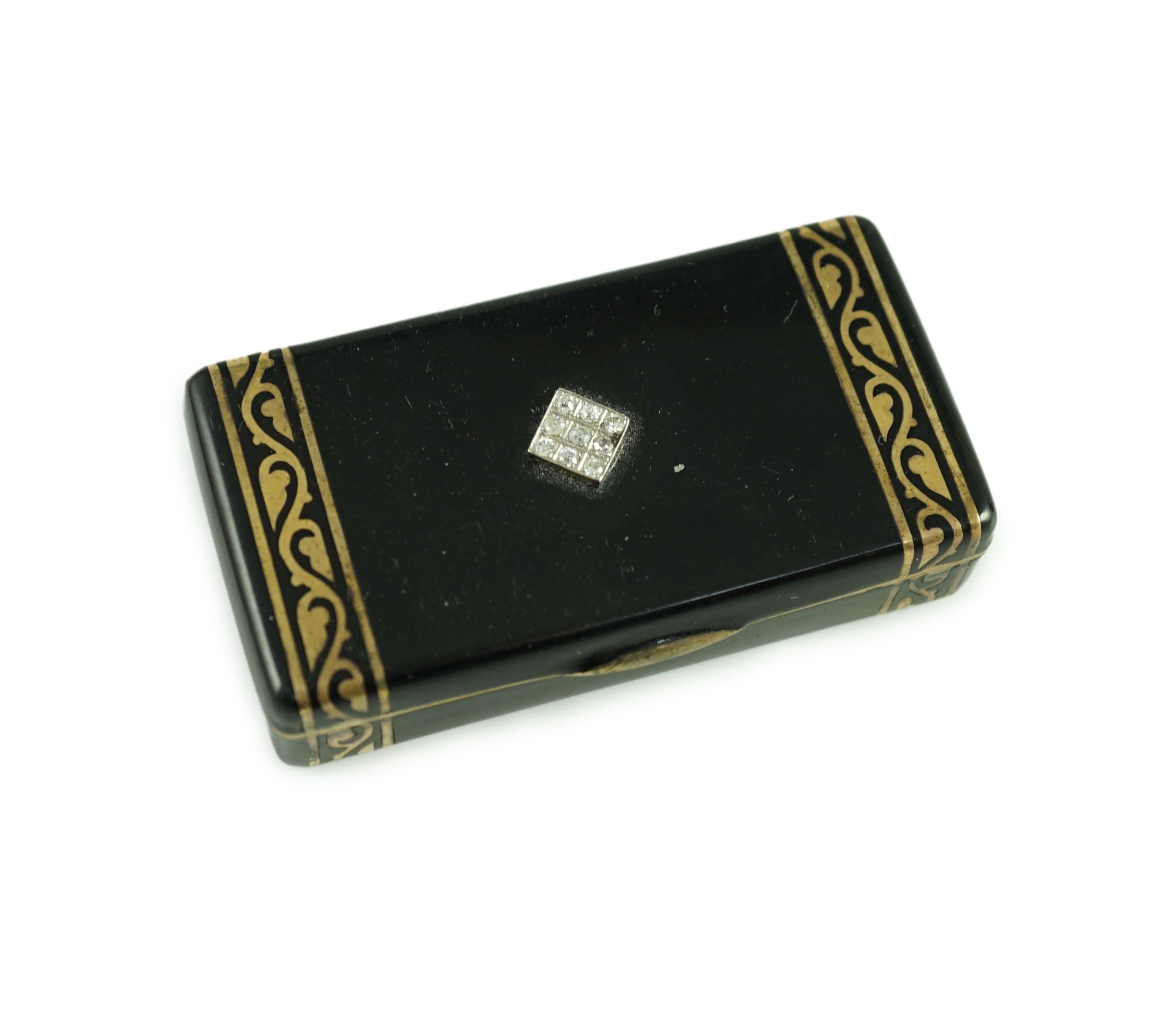 A late 1920's French Cartier silver gilt, black enamel and diamond set snuff box, in fitted gilt tooled leather Cartier box